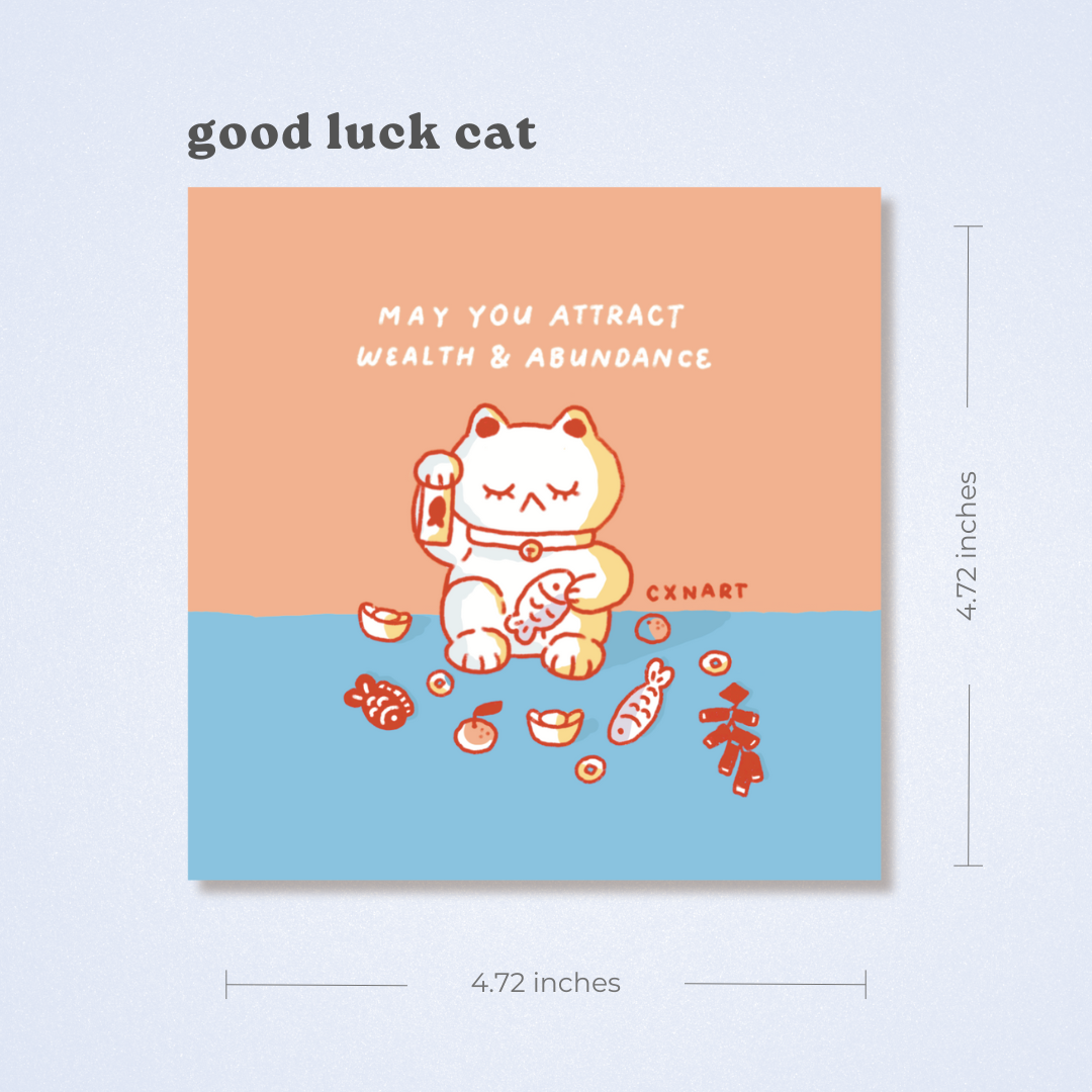 Good luck cat card with peach , coral orange and blue design and CXNART branding. Text, "may you attract wealth and abundance" firecrackers, fish, fold, tangerine