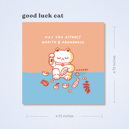 Good luck cat card with peach , coral orange and blue design and CXNART branding. Text, "may you attract wealth and abundance" firecrackers, fish, fold, tangerine